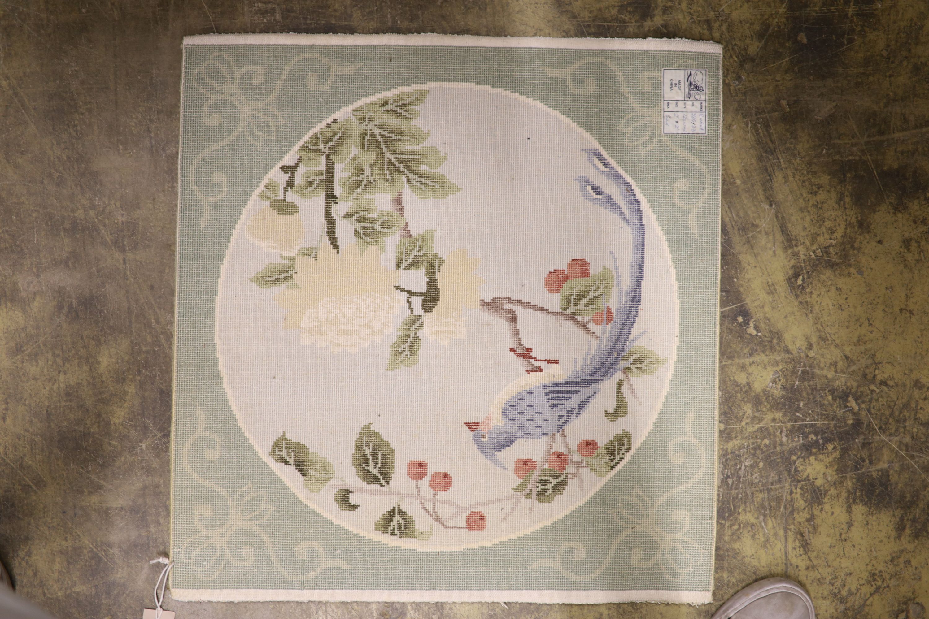 A Chinese washed and embossed panel depicting birds amongst prunus and cherries